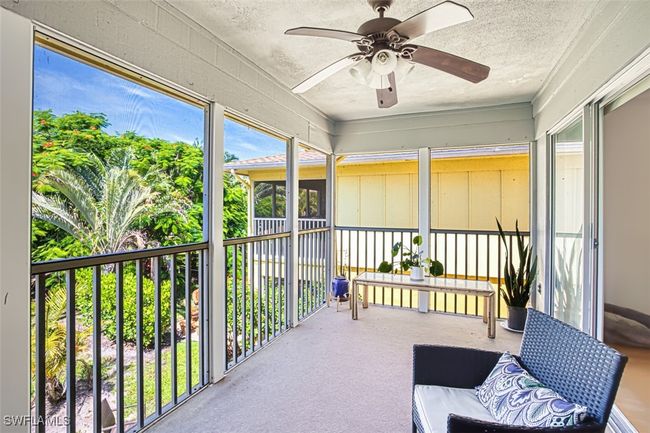 Sunroom with a ceiling fan | Image 12