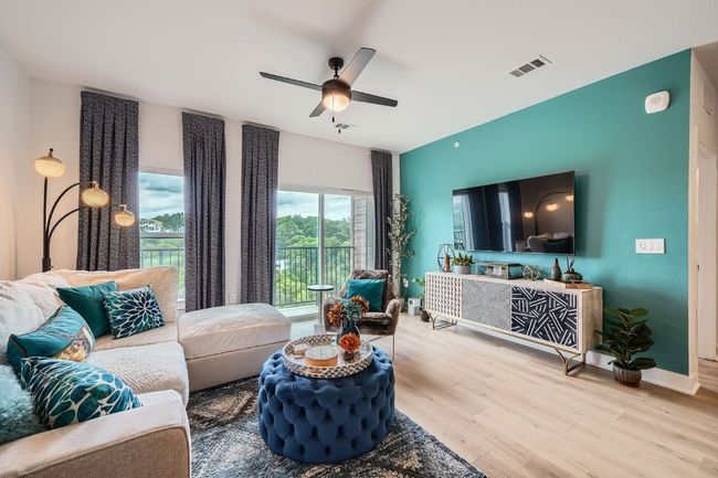 Living area featuring wood finished floors and a ceiling fan | Image 5