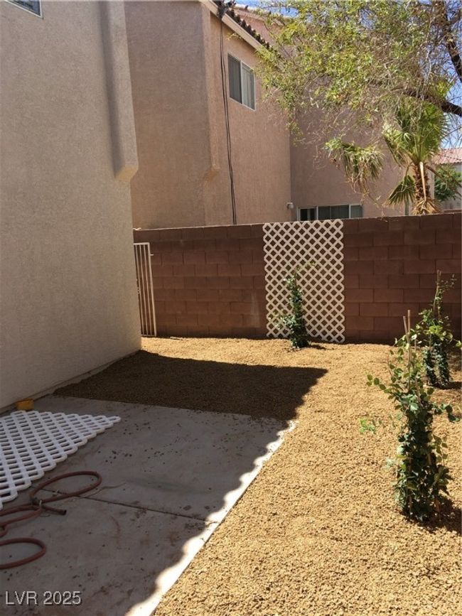 View of yard with fence and a patio area | Image 29