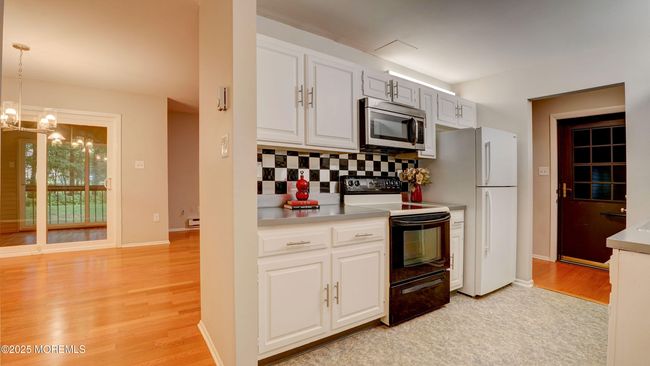 Kitchen looking towards the dining area. | Image 11