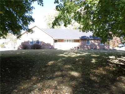 Ranch-style home with a front yard | Image 1