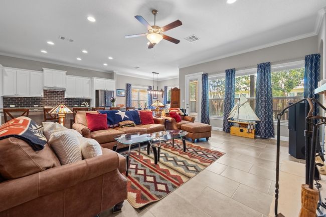 That wall of windows isn’t just for looks, it floods the room with natural light and frames your view of the backyard | Image 13