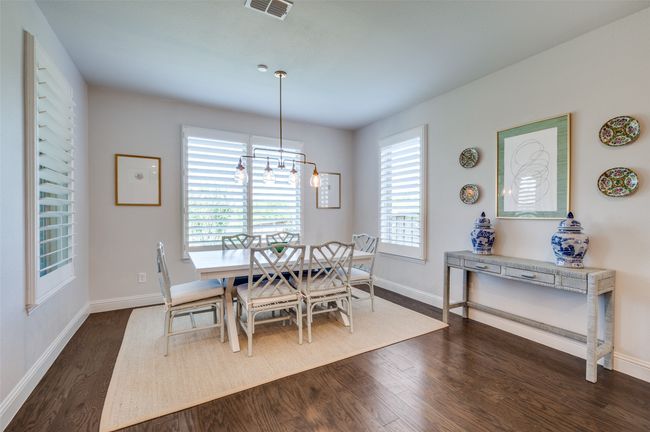 Breakfast nook features upgraded light fixture and loads of windows to bring in the natural light and enjoy the views of the stunning backyard. Perfect space to enjoy your morning coffee or a family meal. | Image 13