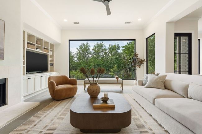 With generous proportions and thoughtful layout, this room easily accommodates oversized furniture while still feeling spacious and open. | Image 6