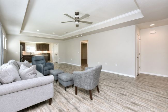 Great Room has tray ceiling for architectural interest. | Image 9