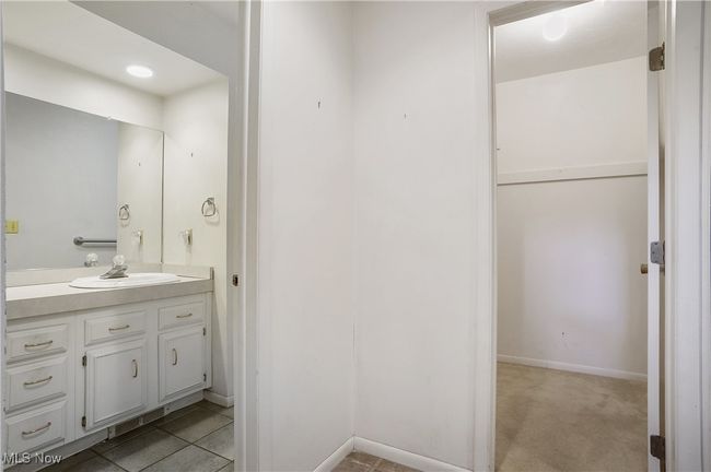 Bathroom featuring baseboards and vanity | Image 35