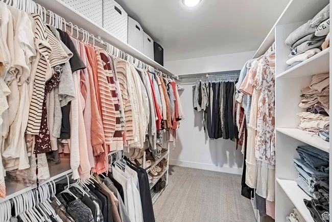 Spacious closet featuring carpet | Image 17