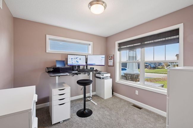 Main floor flex room is currently being used as an office. | Image 6