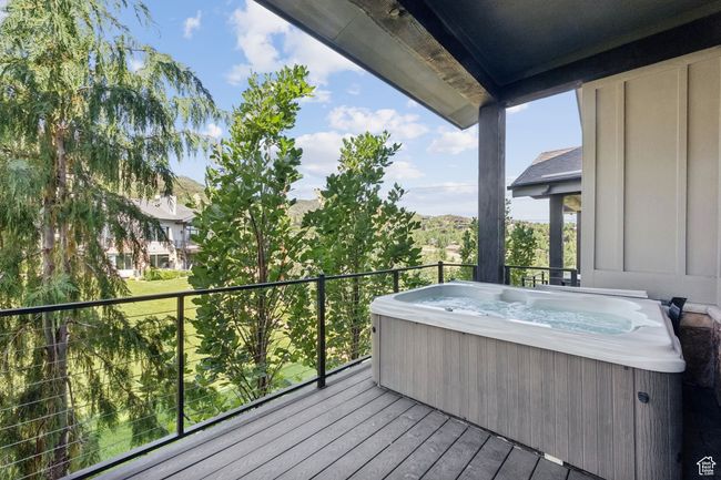 Wooden deck with a hot tub | Image 39