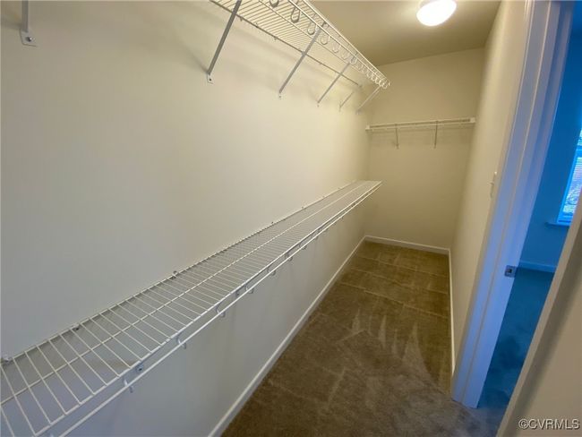 Spacious closet featuring carpet flooring | Image 21