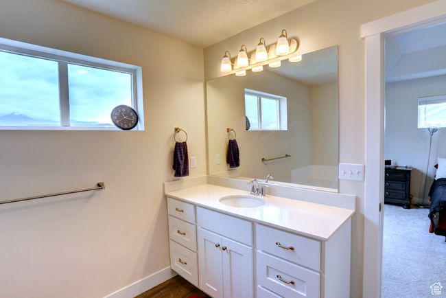 Bathroom featuring baseboards and vanity | Image 14