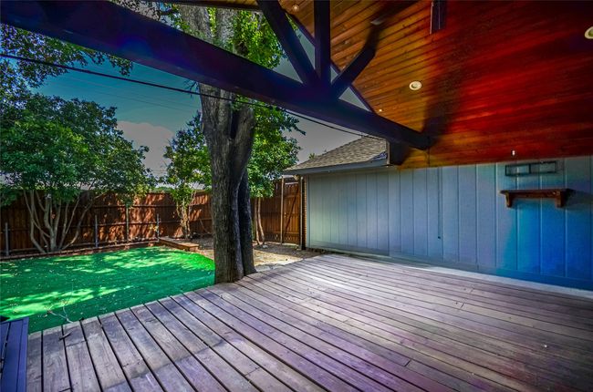 Deck featuring a fenced backyard | Image 26