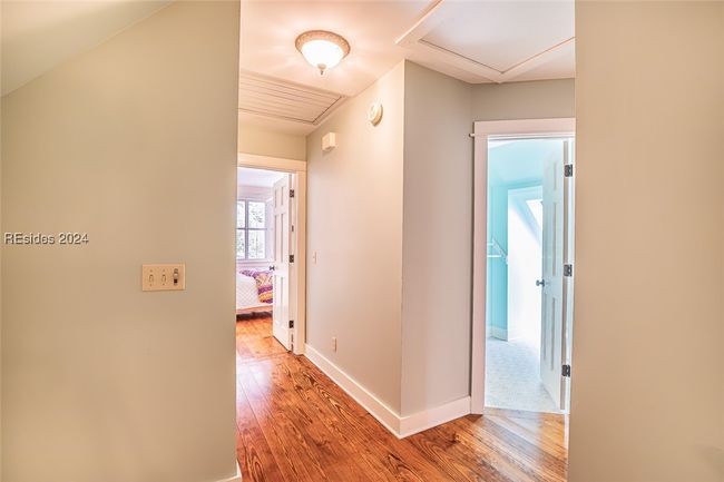 Corridor featuring hardwood / wood-style floors | Image 33
