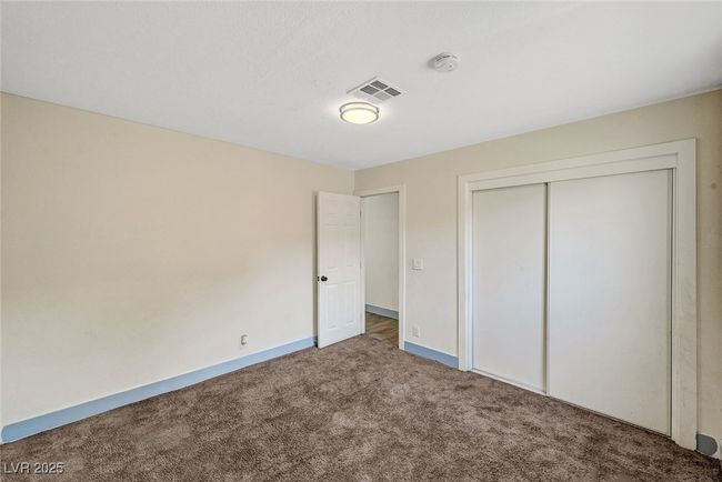 Unfurnished bedroom featuring carpet flooring and a closet | Image 22