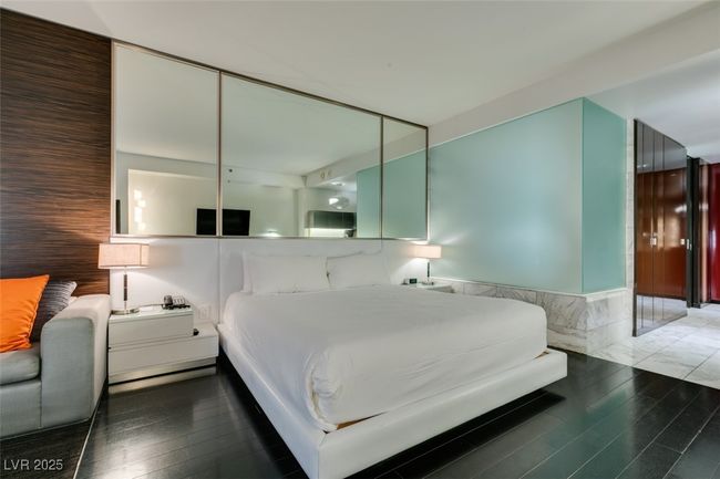 Bedroom with wood finished floors | Image 23
