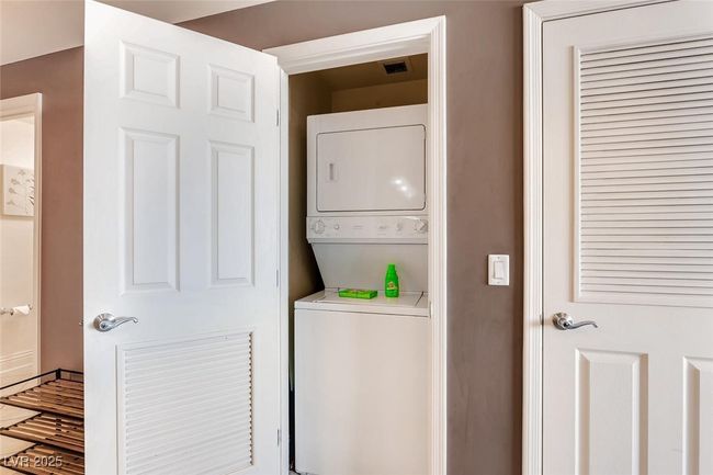 Washroom featuring stacked washer / dryer | Image 40
