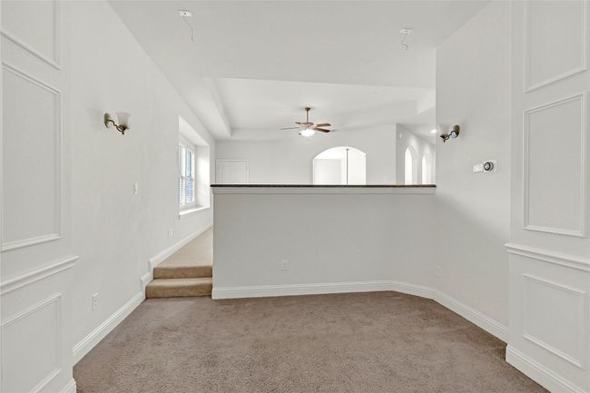 Spare room with light colored carpet and a ceiling fan | Image 26