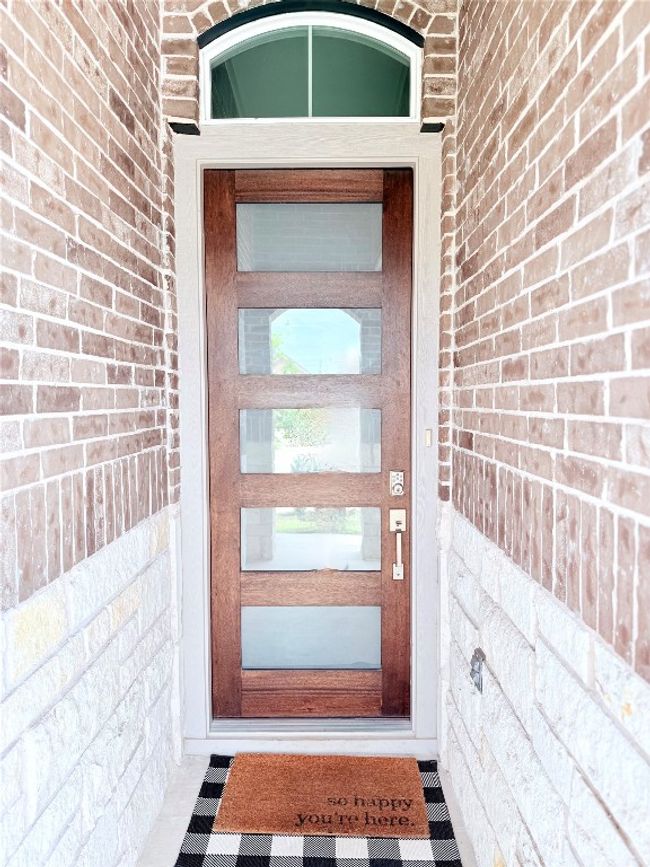 View of exterior entry featuring brick siding | Image 4