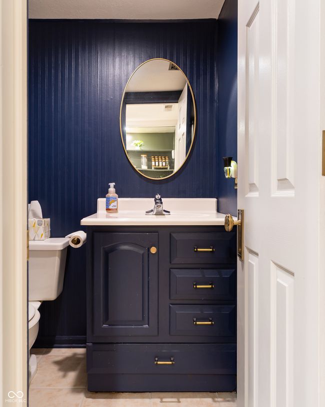 half bath with vanity and tile patterned floors | Image 17