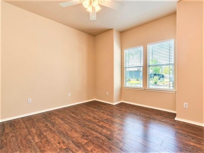 Desirable bedroom floor plan with this bright and spacious main floor primary suite plus two bedrooms upstairs. | Image 4