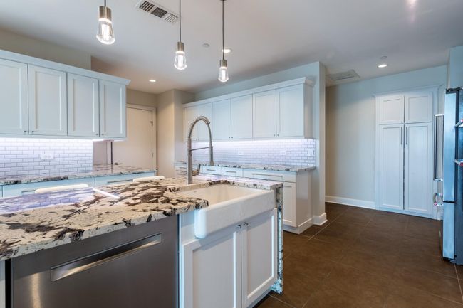 Granite counters, stainless appliances & pantry. | Image 15