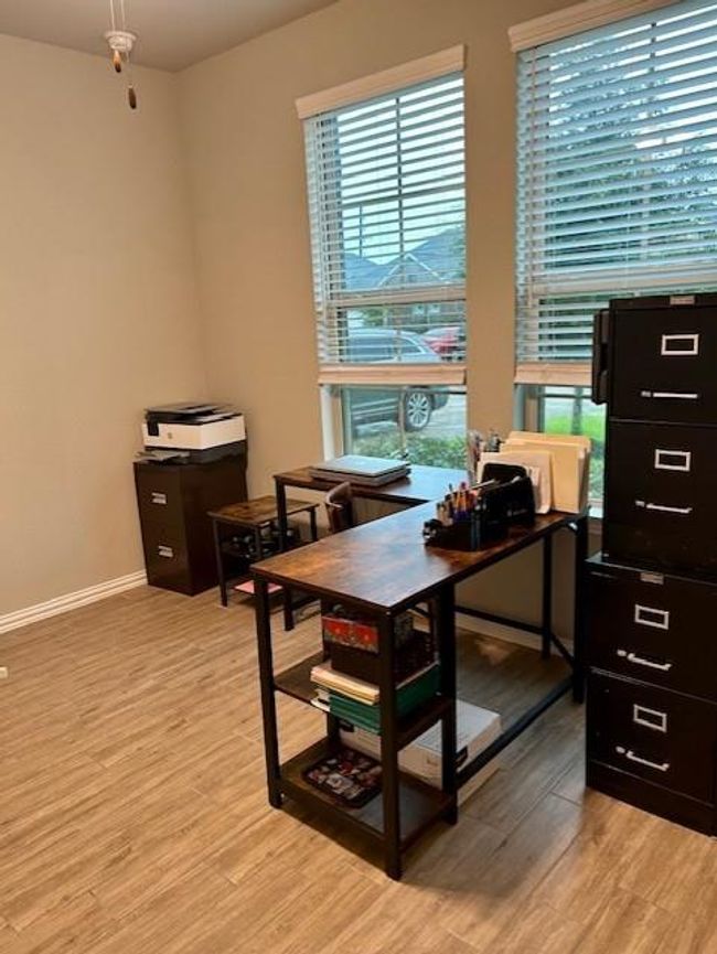 This versatile bedroom/office is bathed in abundant natural light. | Image 23