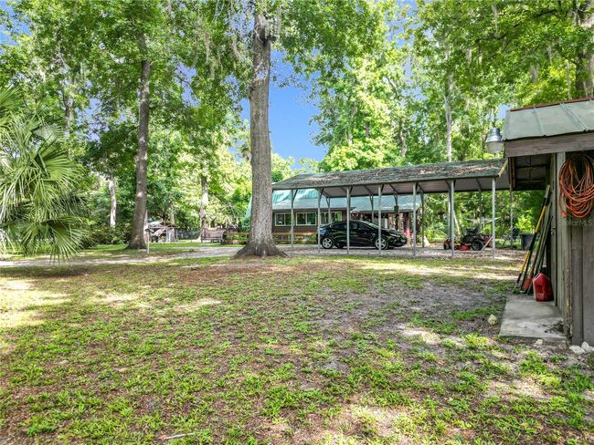 View from the workshop towards the right side of the house. Note the large and extra tall RV carport | Image 44