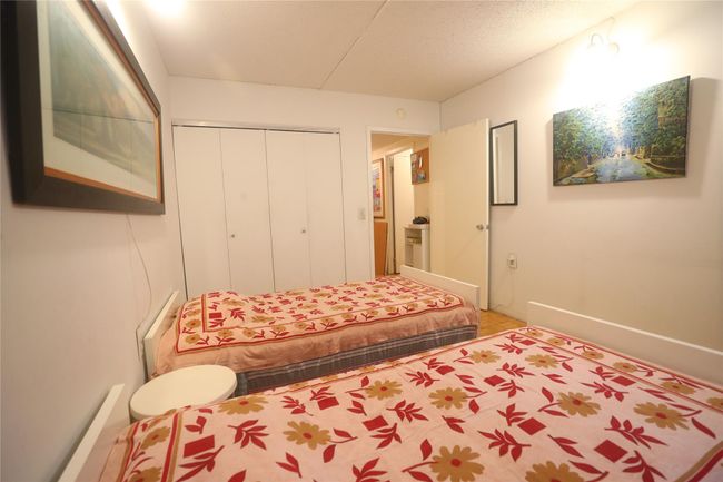 Bedroom featuring a closet and baseboards | Image 22