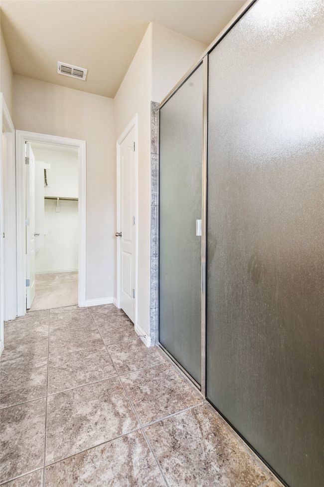 Full bathroom with a stall shower and tile patterned floors | Image 24