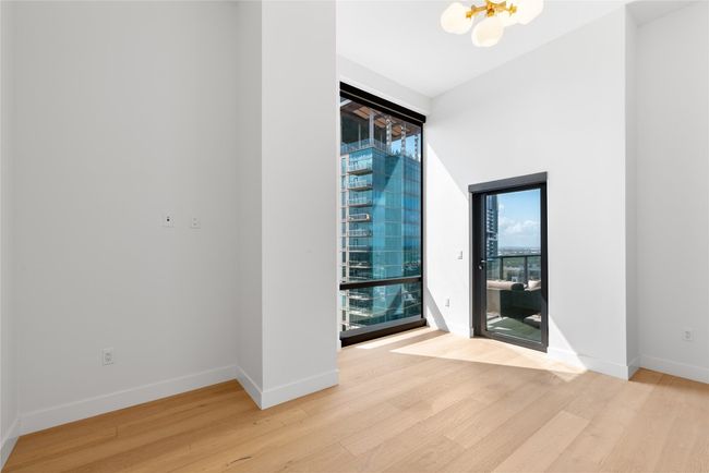 Spare room with light wood finished floors and baseboards | Image 12