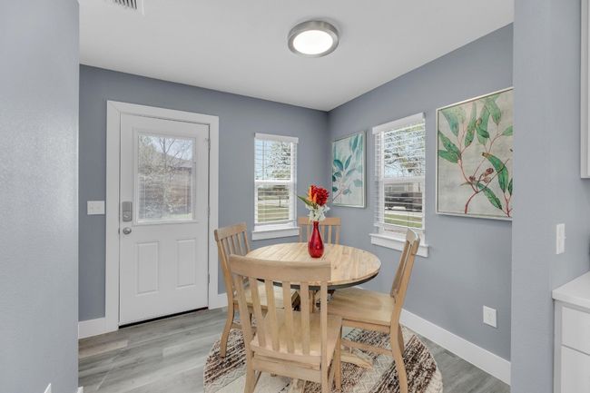 Dining space with baseboards and light wood finished floors | Image 16