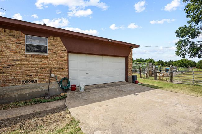 Garage featuring concrete driveway | Image 34