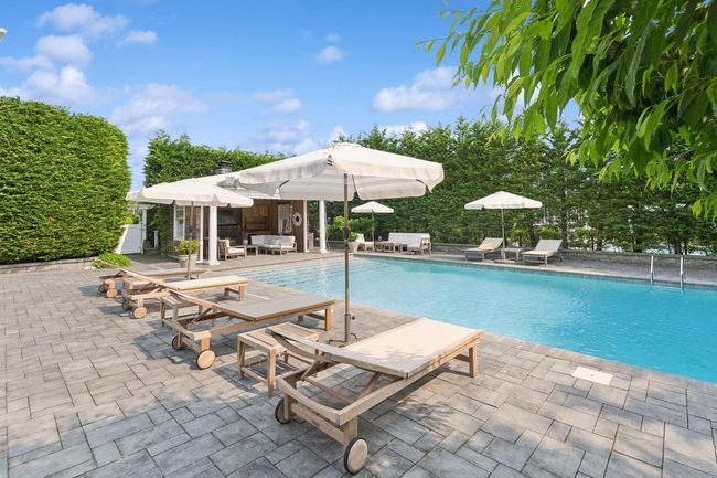 Outdoor pool featuring a patio area, an outbuilding, and a storage structure | Image 28