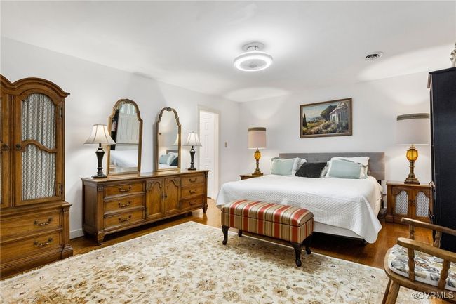 Bedroom featuring wood finished floors | Image 33