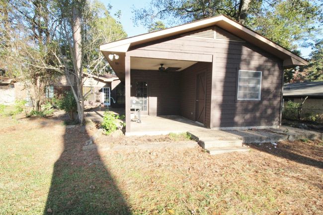 Large covered patio that extends to a big open patio. Plenty of room for entertaining | Image 30
