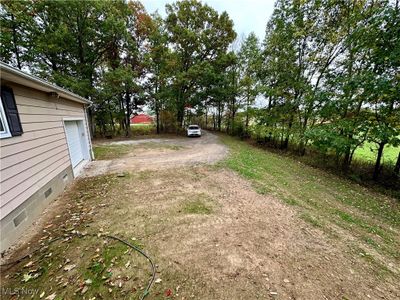 View of yard featuring a garage | Image 2