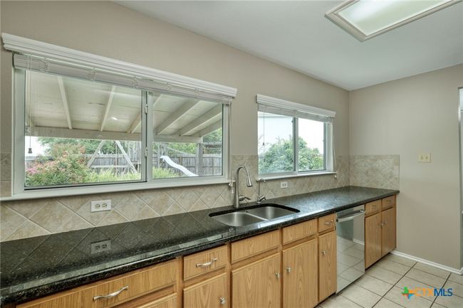 Kitchen counter with lovely granite surface and energy saving Dishwasher | Image 14