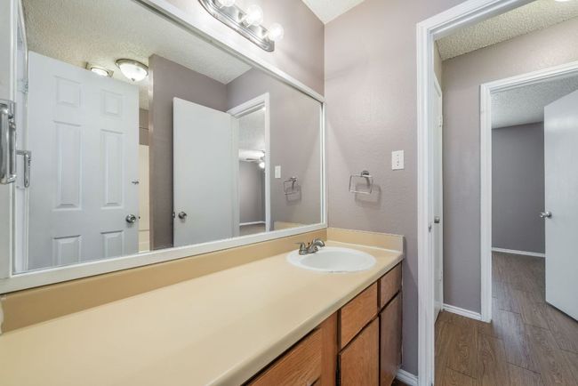 Bathroom featuring vanity, wood finished floors, and a textured ceiling | Image 24