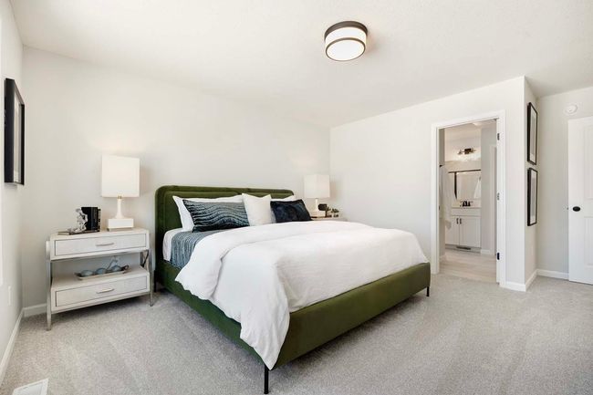 Primary bedroom includes private bath and walk-in closet. | Image 12