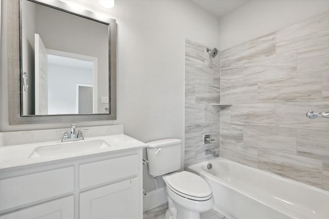 Full bathroom featuring vanity and shower / bath combination | Image 33