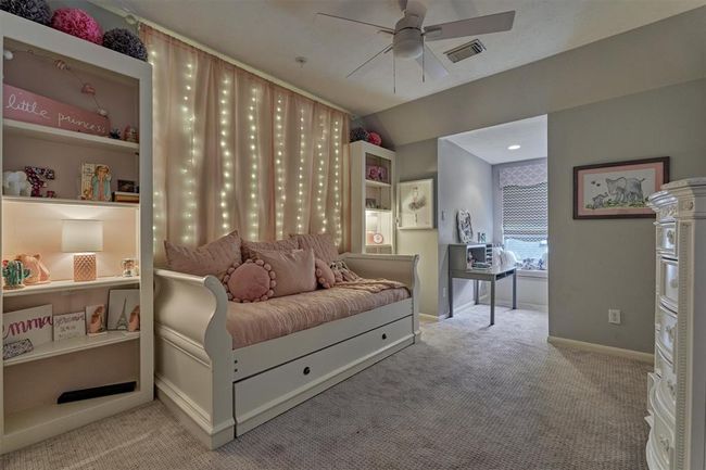 Bedroom #4 with front window and window seat. | Image 34