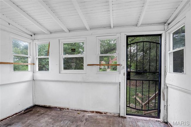 View of unfurnished sunroom | Image 17