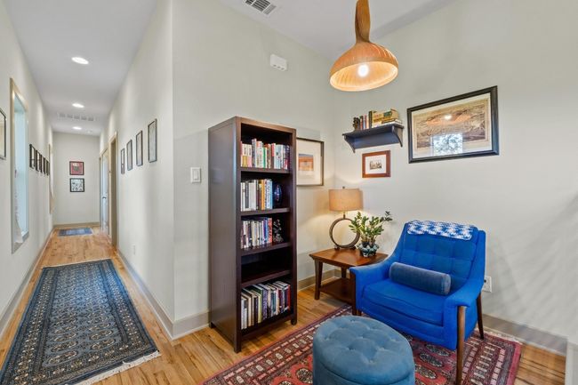 Living area with visible vents, baseboards, recessed lighting, and wood finished floors | Image 17