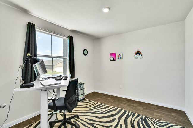 Office space with dark wood-type flooring and baseboards | Image 5