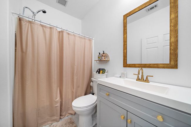 Bathroom with a shower and simple, clean design | Image 25