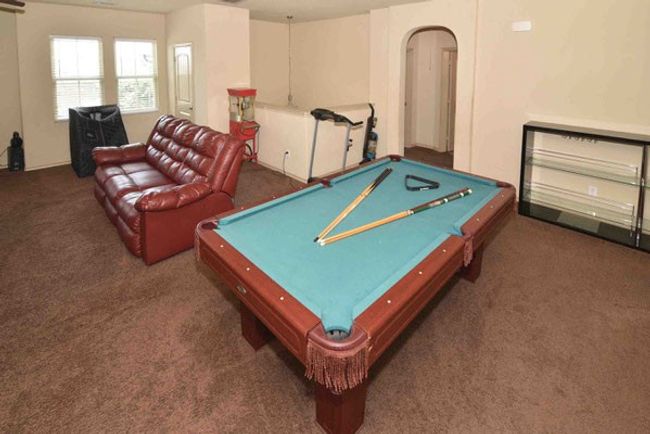 Rec room with arched walkways, carpet flooring, and billiards table | Image 23
