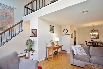 An open floor plan that flows from the Living Room to the Dining area and updated kitchen | Image 2