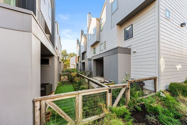 View of property exterior featuring fence | Image 33