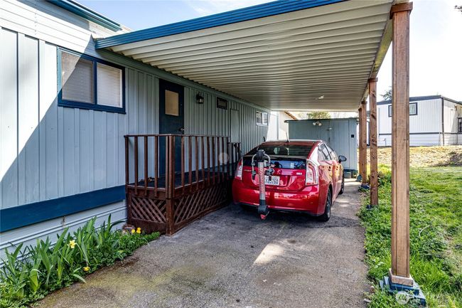 The carport and one of the two sheds. Plenty of parking here. | Image 32