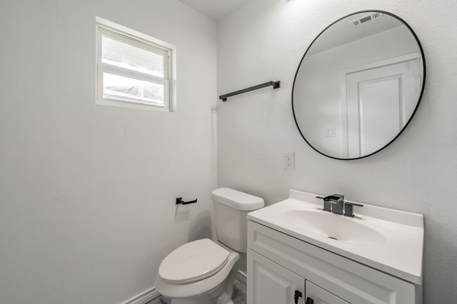 Bathroom featuring vanity and toilet | Image 12